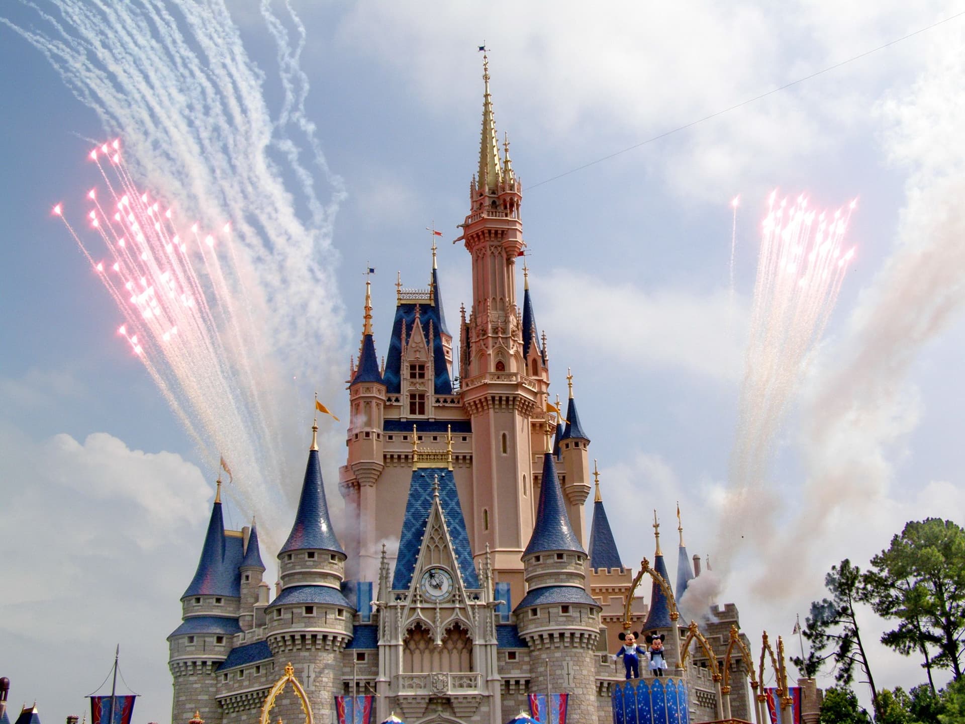 Fireworks over a fairy-tale castle at night